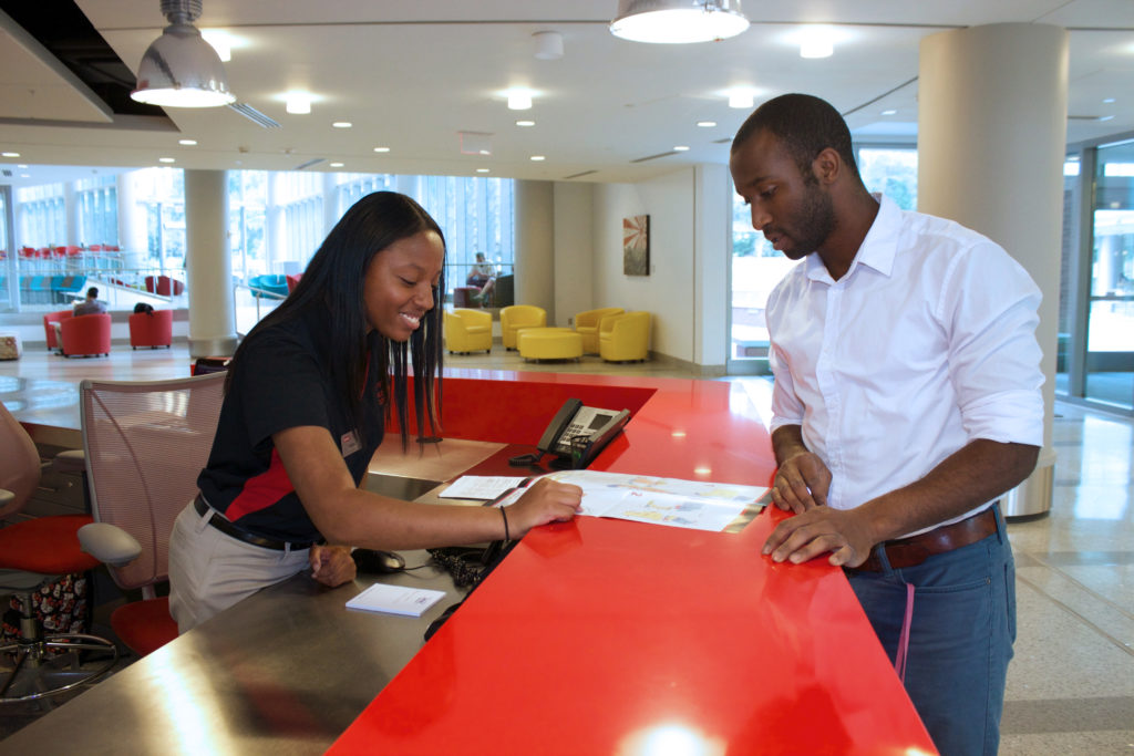 A visitor at Talley Student Union receives assistance at the Info Desk.